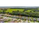 Beautiful home nestled in a community near a large marshy landscape with lush trees and blue lake in the background at 3837 Carrick Bend Dr, Kissimmee, FL 34746