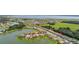 Beautiful aerial view of a lakeside residential community with houses nestled among trees and water features at 3837 Carrick Bend Dr, Kissimmee, FL 34746