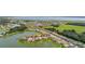 Beautiful aerial view featuring a serene lake amidst homes in a well-planned residential community at 3837 Carrick Bend Dr, Kissimmee, FL 34746