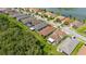 Aerial shot of a home with a screened-in porch and patio area, set in a well-maintained residential neighborhood at 3837 Carrick Bend Dr, Kissimmee, FL 34746