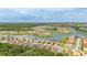 Aerial view showcasing the residential community, with homes nestled around a beautiful lake at 3837 Carrick Bend Dr, Kissimmee, FL 34746