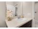 Bathroom showing a vanity with a sink, a large mirror, floral decor, and nice fixtures at 3837 Carrick Bend Dr, Kissimmee, FL 34746