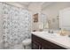 Bright bathroom features a tub/shower, toilet, vanity with a sink and a vanity mirror at 3837 Carrick Bend Dr, Kissimmee, FL 34746