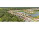 Aerial view of a well-planned community featuring picturesque homes and a serene lake at 3837 Carrick Bend Dr, Kissimmee, FL 34746