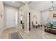Elegant foyer featuring tile floors, neutral walls, decorative niches, and a view into the formal sitting room at 3837 Carrick Bend Dr, Kissimmee, FL 34746