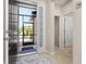 Inviting foyer featuring tile flooring, neutral walls, and a view of the screened front entry at 3837 Carrick Bend Dr, Kissimmee, FL 34746