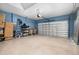 Spacious garage with an automatic door and ample space for multiple vehicles and storage at 3837 Carrick Bend Dr, Kissimmee, FL 34746