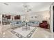 A spacious living room with dark cabinets, granite countertops and stainless steel appliances at 3837 Carrick Bend Dr, Kissimmee, FL 34746
