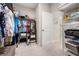 Walk-in closet featuring built-in shelving for linens and clothing storage at 3837 Carrick Bend Dr, Kissimmee, FL 34746