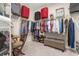 Spacious walk-in closet with ample storage and organization, featuring built-in shelving and rod space for an extensive wardrobe at 3837 Carrick Bend Dr, Kissimmee, FL 34746
