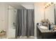 Bathroom features a shower and tub combination with neutral colored walls and granite countertop at 4008 San Sebastian Dr # 105, Kissimmee, FL 34741