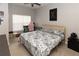 Stylish bedroom with a comfortable bed, modern desk, and ample natural light, creating a relaxing retreat at 4008 San Sebastian Dr # 105, Kissimmee, FL 34741