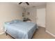 Cozy bedroom with carpeted floors, ceiling fan, and neutral colored walls at 4008 San Sebastian Dr # 105, Kissimmee, FL 34741