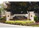 Welcoming Venetian Bay Villages sign surrounded by colorful landscaping, showcasing community pride and curb appeal at 4008 San Sebastian Dr # 105, Kissimmee, FL 34741