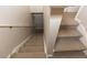 A carpeted staircase leads down to another level of the home at 4008 San Sebastian Dr # 105, Kissimmee, FL 34741