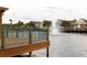 Picturesque water view from the dock, showcasing the tranquil lake and colorful townhouses at 4008 San Sebastian Dr # 105, Kissimmee, FL 34741