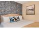 Cozy bedroom with textured wall, comfortable king size bed and decorative pillows at 4547 Narrative Ln, Kissimmee, FL 34746