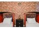 Fun bedroom with brick wall, Platform 9 3/4 sign, and twin beds with train decor at 4547 Narrative Ln, Kissimmee, FL 34746