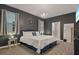 Contemporary bedroom featuring a decorative clock on the wall and full-length mirror at 4547 Narrative Ln, Kissimmee, FL 34746
