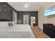 Comfortable bedroom with a decorative clock on the wall and walk out to patio at 4547 Narrative Ln, Kissimmee, FL 34746