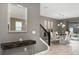 Contemporary dining area with modern light fixture and view of the outdoor pool at 4547 Narrative Ln, Kissimmee, FL 34746