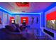 Entertaining game room featuring superhero-themed decorations, a comfortable sofa, and a classic arcade machine at 4547 Narrative Ln, Kissimmee, FL 34746