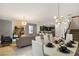 Open-concept living area showcasing kitchen, dining, and living spaces at 4547 Narrative Ln, Kissimmee, FL 34746