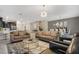 Spacious open living area with comfortable sofas and a dining area, perfect for Gathering gatherings at 4547 Narrative Ln, Kissimmee, FL 34746