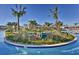 Community pool island with tropical landscaping and lounge seating at 4547 Narrative Ln, Kissimmee, FL 34746