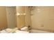 Bathroom featuring a tub/shower combo with tile surround, a toilet, and a vanity with a sink at 5287 Images Cir # 303, Kissimmee, FL 34746