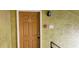 Apartment entrance with door marked 303, fire alarm sign, and textured walls in a hallway setting at 5287 Images Cir # 303, Kissimmee, FL 34746