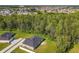 Aerial shot showcasing a home nestled near a dense tree line at 536 Bristol Cir, Kissimmee, FL 34758