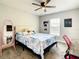 Cozy bedroom with bright natural light, a ceiling fan, and a desk to create a versatile space at 536 Bristol Cir, Kissimmee, FL 34758