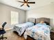 Bedroom with twin beds, a ceiling fan, and window offering natural light at 536 Bristol Cir, Kissimmee, FL 34758