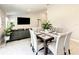 Bright dining room featuring a table with seating for six and modern decor at 536 Bristol Cir, Kissimmee, FL 34758