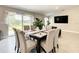 Dining room adjacent to the living room and featuring sliding doors with backyard access at 536 Bristol Cir, Kissimmee, FL 34758