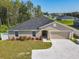 An elevated perspective of a single-story home highlighting the clean landscaping and attached two-car garage at 536 Bristol Cir, Kissimmee, FL 34758