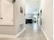 Inviting hallway with ceramic tile, neutral walls, and glimpses of the living room beyond at 536 Bristol Cir, Kissimmee, FL 34758