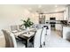 Open-concept kitchen featuring stainless steel appliances, granite countertops, and bar stool seating at 536 Bristol Cir, Kissimmee, FL 34758