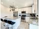 Full kitchen with stainless steel appliances, granite countertops, a kitchen island, and bar stool seating at 536 Bristol Cir, Kissimmee, FL 34758