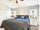 Comfortable main bedroom with dual dressers, ceiling fan, and soft carpeting at 536 Bristol Cir, Kissimmee, FL 34758