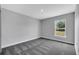 Bedroom features neutral walls, carpet flooring and a window overlooking the yard at 547 Viceroy Ct, Kissimmee, FL 34758