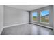 Bright bedroom features neutral walls, tile floors, and large windows at 547 Viceroy Ct, Kissimmee, FL 34758