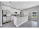 Modern kitchen features stainless steel appliances, granite countertops, and white cabinetry at 547 Viceroy Ct, Kissimmee, FL 34758