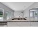 Close-up of granite countertops and stainless steel sink in a modern, open-concept kitchen at 547 Viceroy Ct, Kissimmee, FL 34758