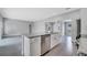 Open-concept kitchen with island, granite countertops, stainless steel dishwasher, and ample cabinet space at 547 Viceroy Ct, Kissimmee, FL 34758
