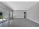 Bright living room with tile flooring, recessed lighting, and a sliding glass door at 547 Viceroy Ct, Kissimmee, FL 34758