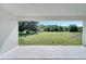 Covered patio overlooking spacious backyard and trees, great for outdoor entertainment or relaxation at 547 Viceroy Ct, Kissimmee, FL 34758