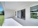 Covered patio featuring a sliding glass door entry, extending your living space outdoors for relaxation and enjoyment at 547 Viceroy Ct, Kissimmee, FL 34758