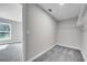 Walk-in closet with neutral walls, plush carpeting, and wire shelving for organization at 547 Viceroy Ct, Kissimmee, FL 34758